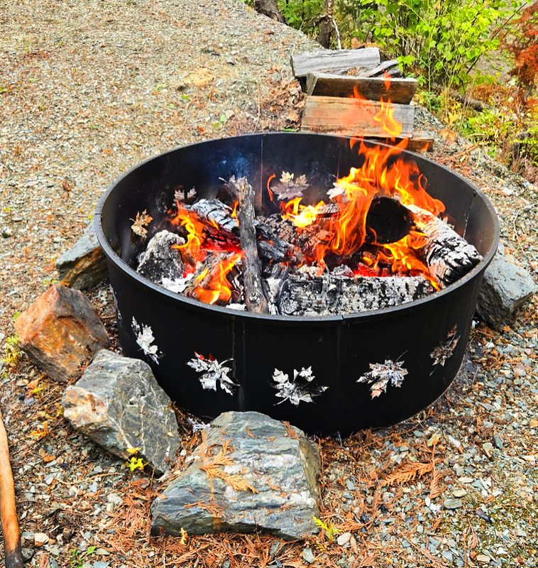 Fire burning in the steel fire ring on Lot 117